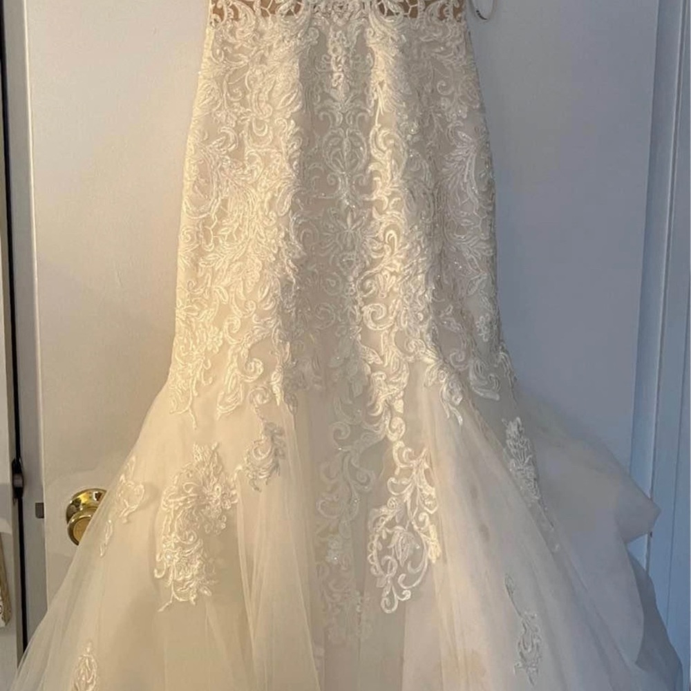 Essence of Australia wedding gown with veil size 8 . Fits regular size 2 .